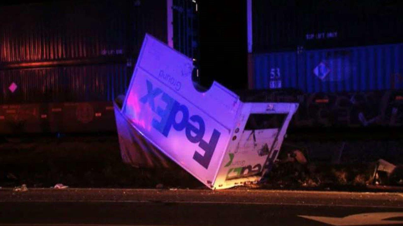 Freight train destroys FedEx truck