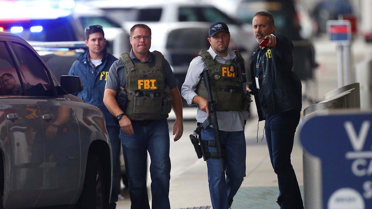 Authorities work to determine motive behind airport shooting