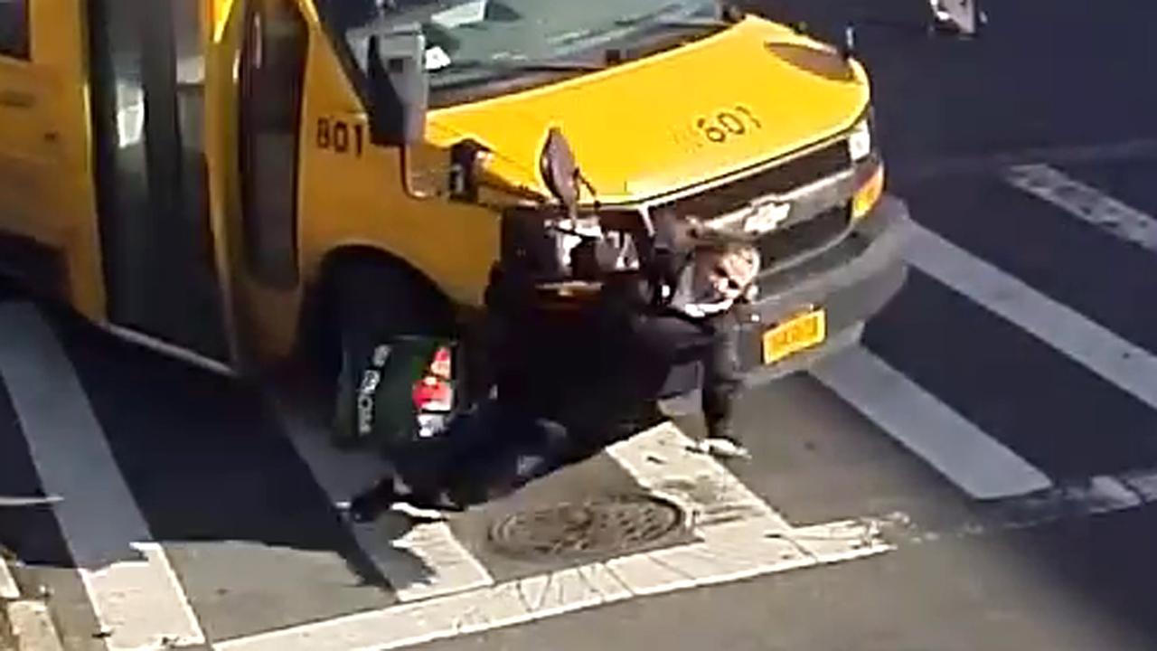 Warning, graphic video: Woman knocked down, run over by bus