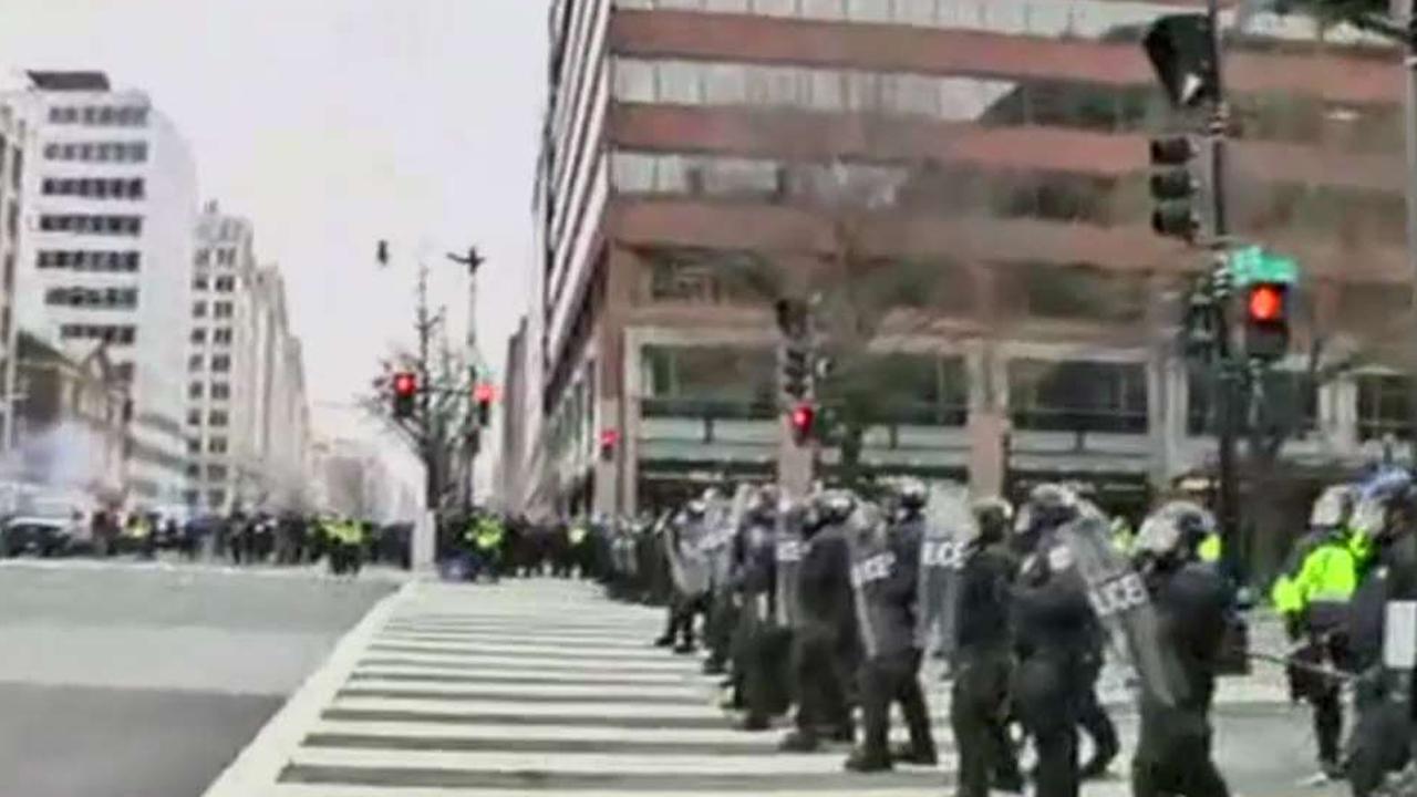 Riot police charge DC protesters