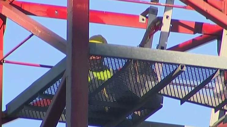 Protesters climb construction crane near White House