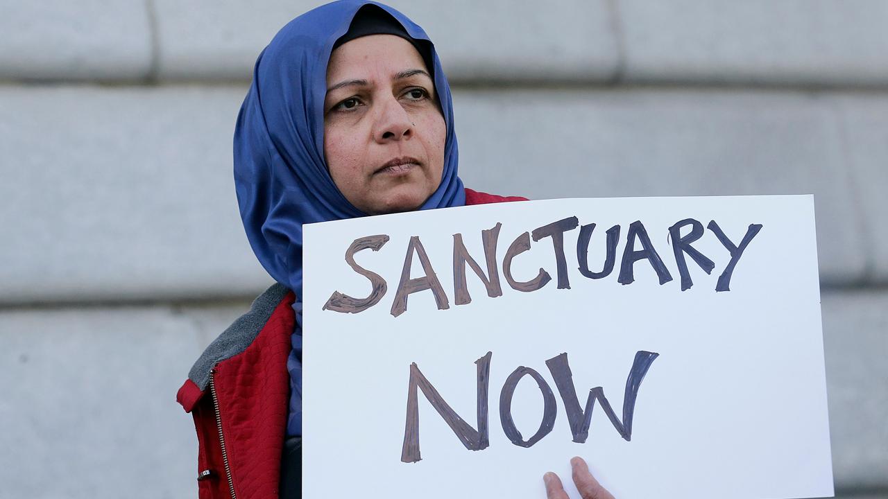 Sanctuary cities vow to defy president's executive order