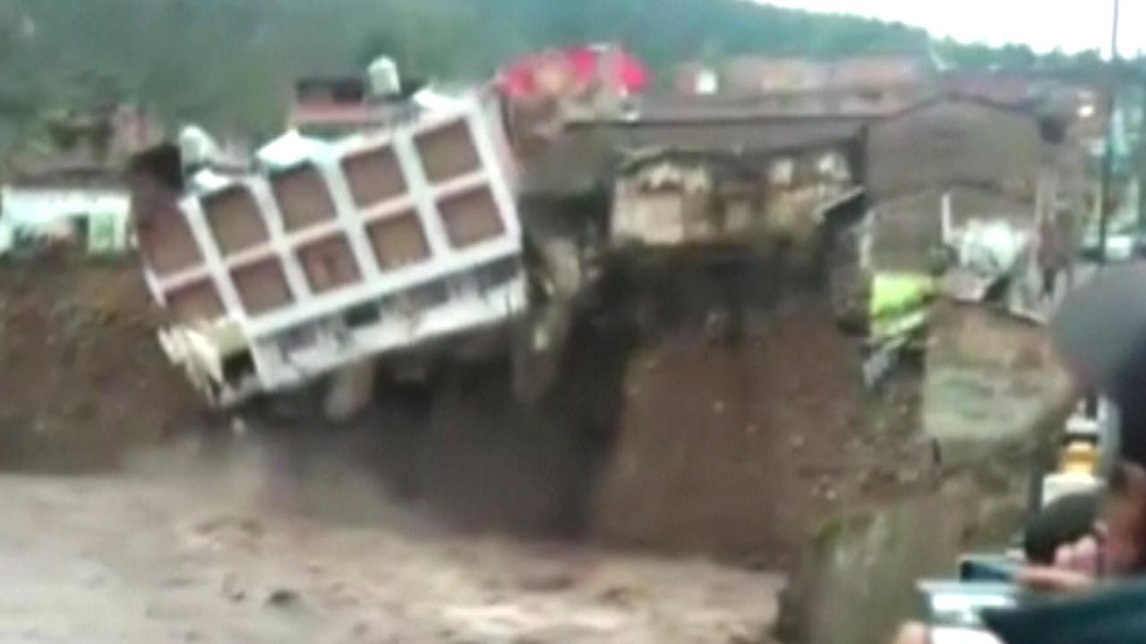 Dramatic hotel collapse into river caught on tape
