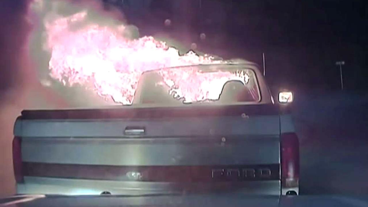 Hero cop pushes burning truck away from restaurant