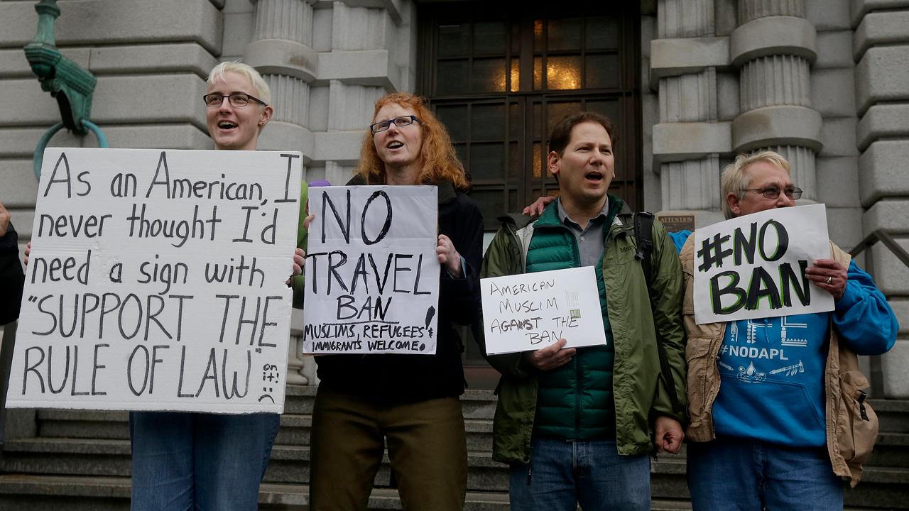What must revised travel ban do to clear legal hurdles?