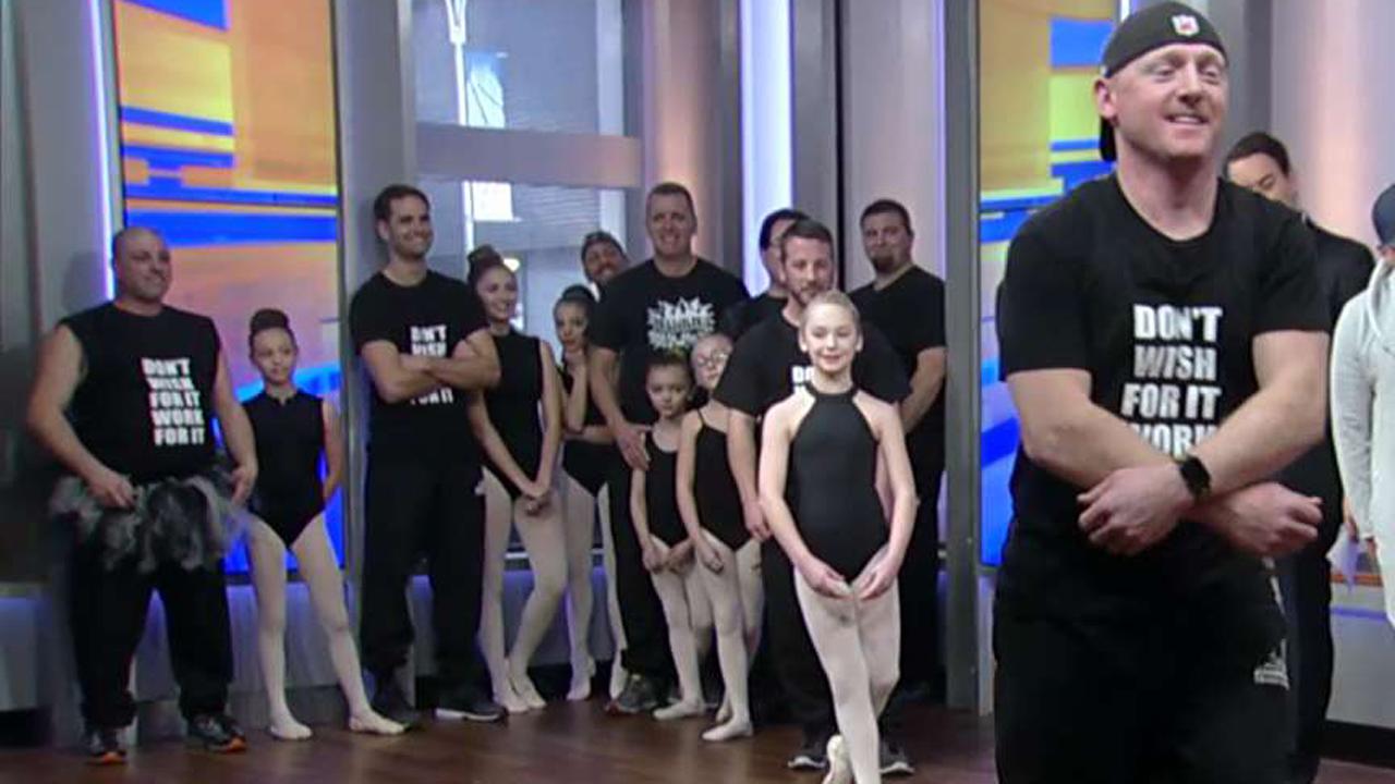 Dads join their daughters for a ballet lesson 