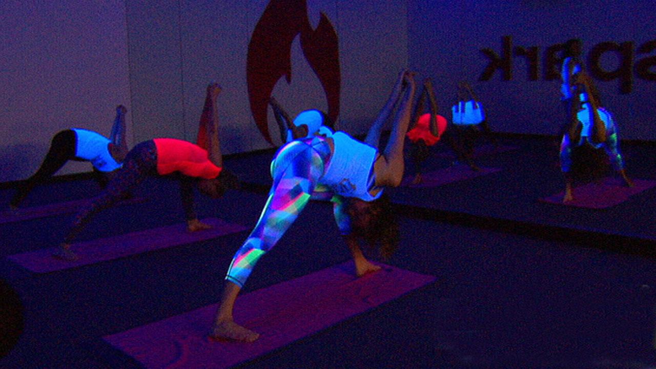 New fitness trend brings party atmosphere to yoga practice