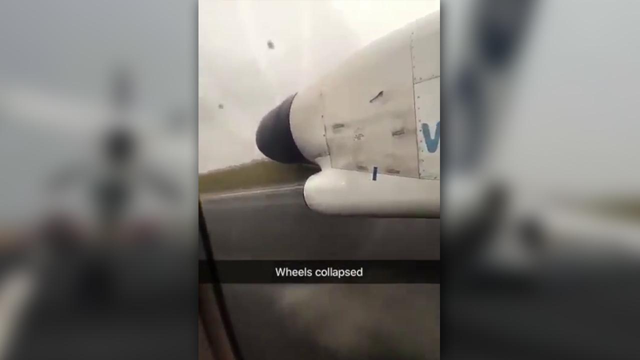 Frightening hard landing captured on video from inside plane