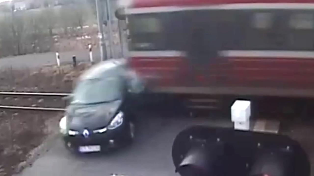 Moment of impact: Driver tries to beat speeding train, loses