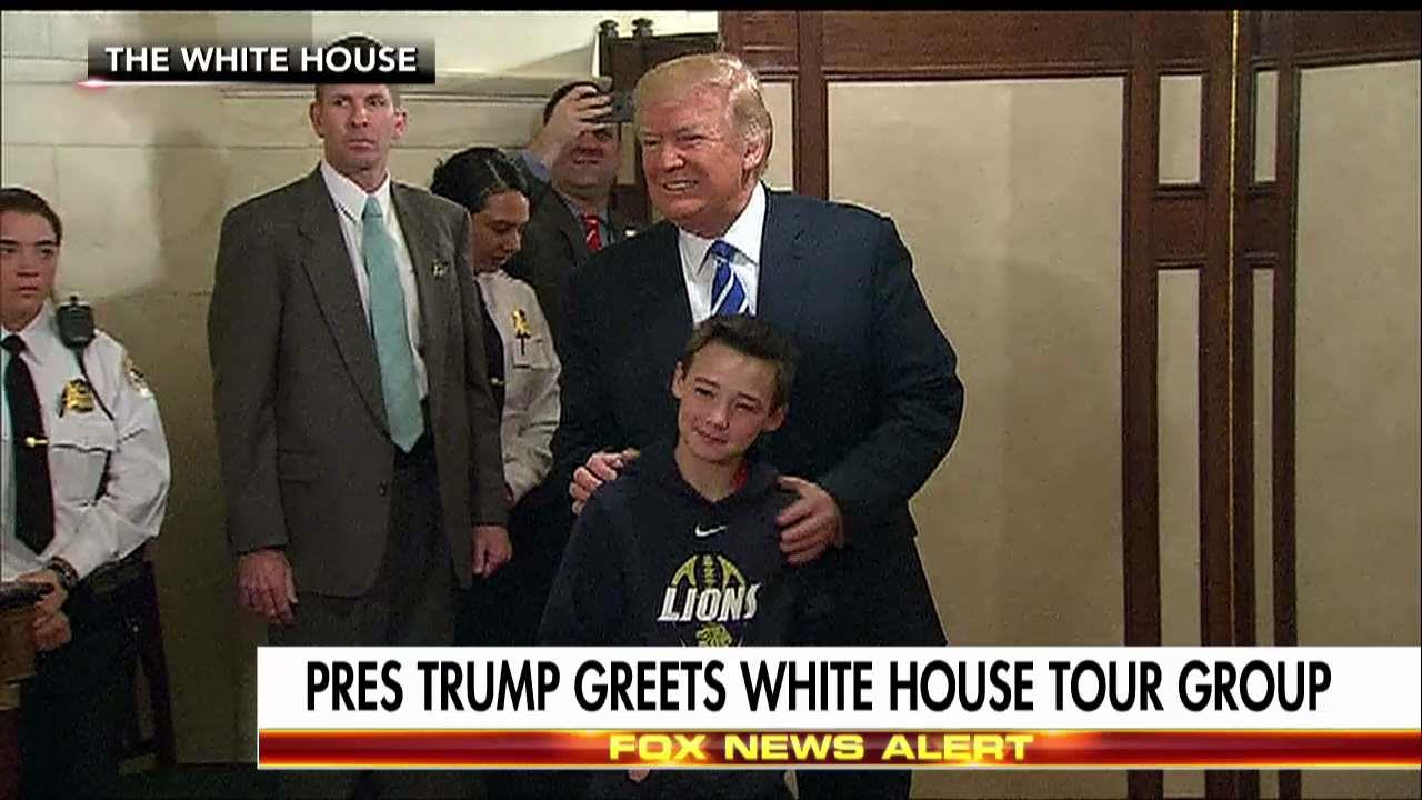 Trump greets visitors