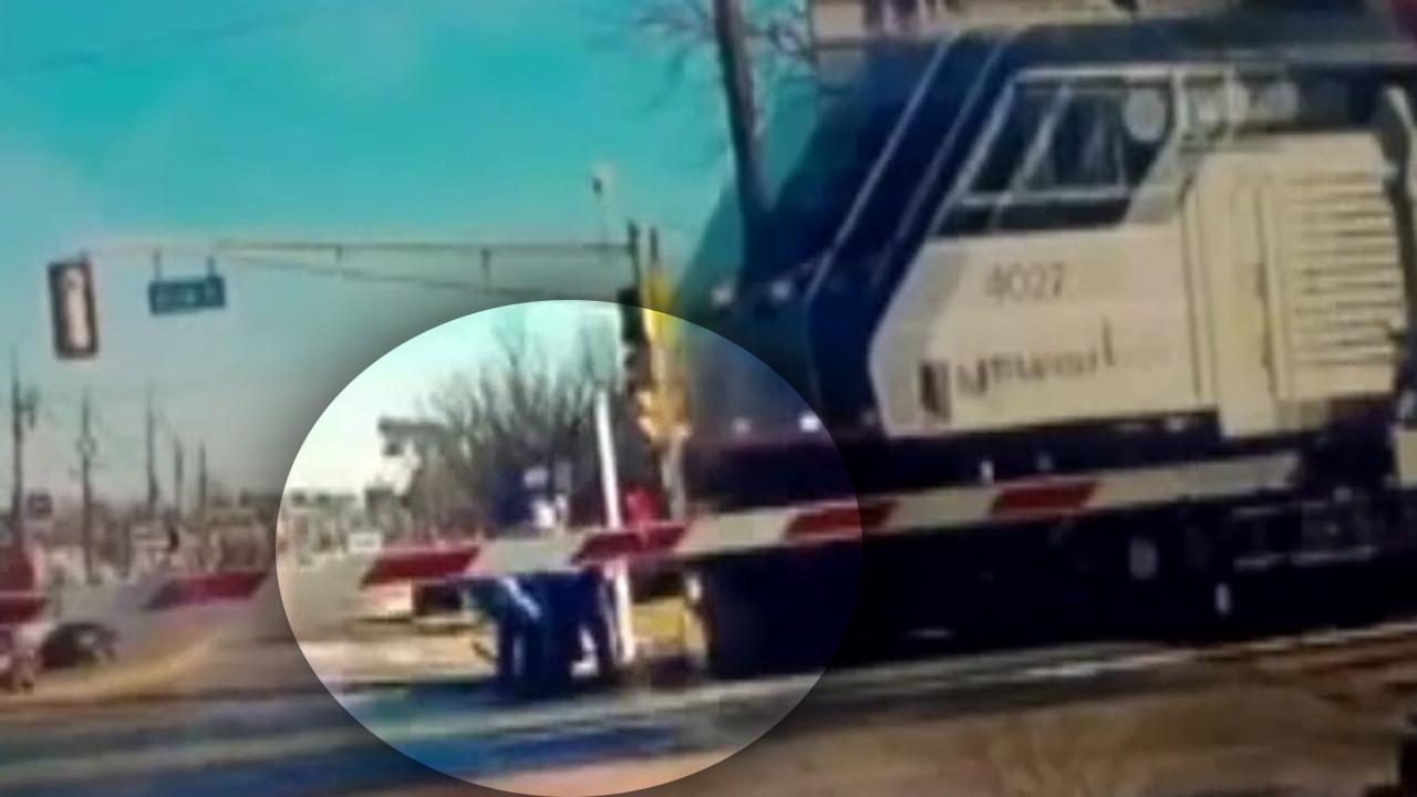 Heroes rush to save elderly woman from oncoming train