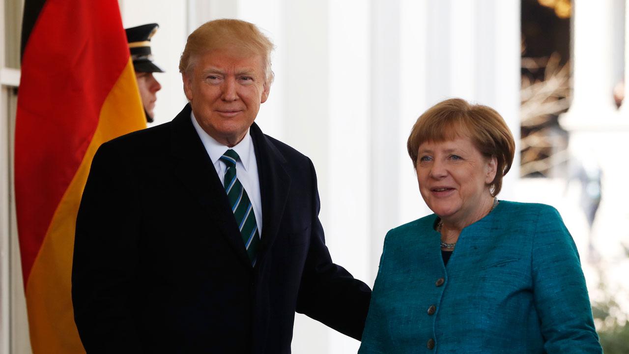 Trump, Merkel defend responses to refugee crisis