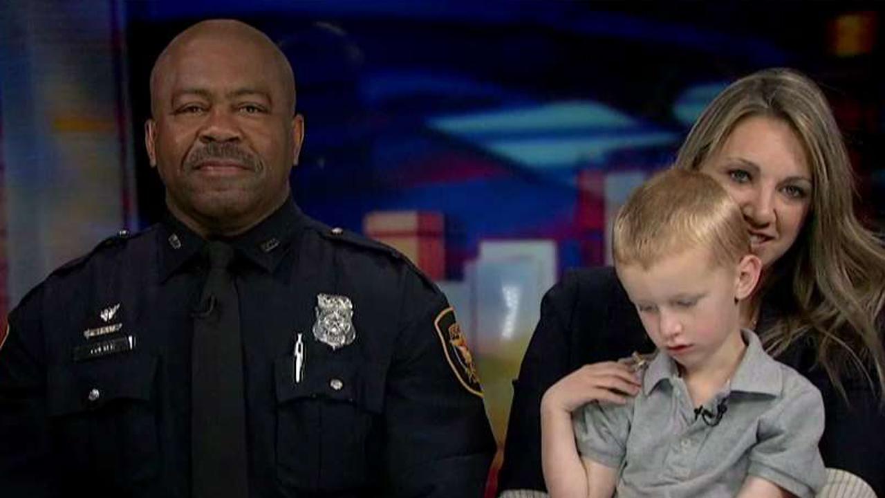 Viral video shows 3-year-old hug officer sitting alone