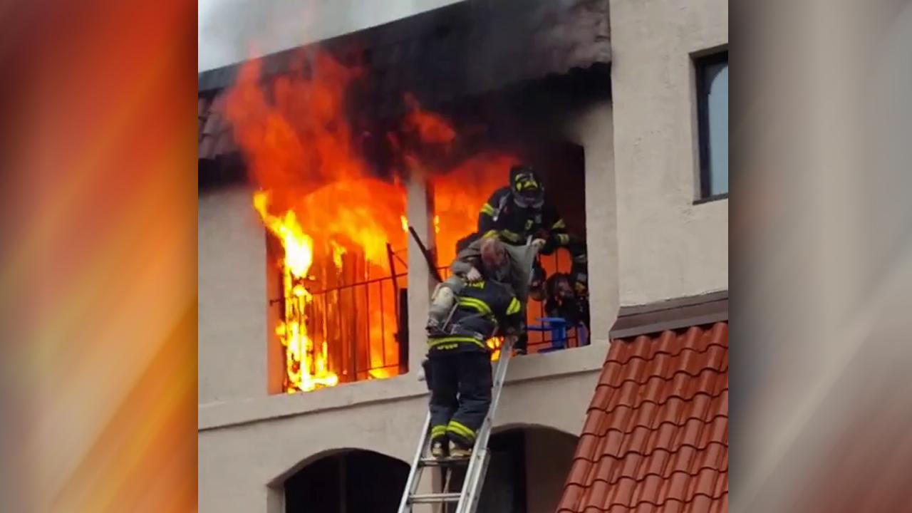 Hero firefighters rush into blaze to save 82-year-old man