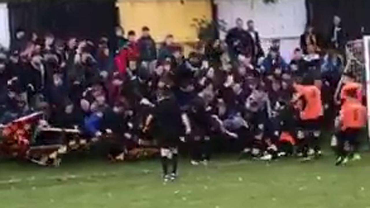 Soccer players crushed by fans celebrating goal