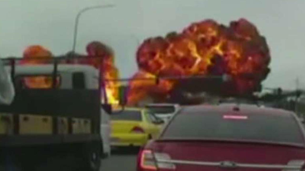 Plane crash causes horrifying fireball on busy road
