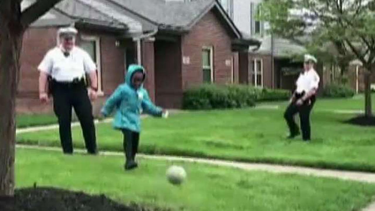 Cops take break from shooting probe to play soccer with kids