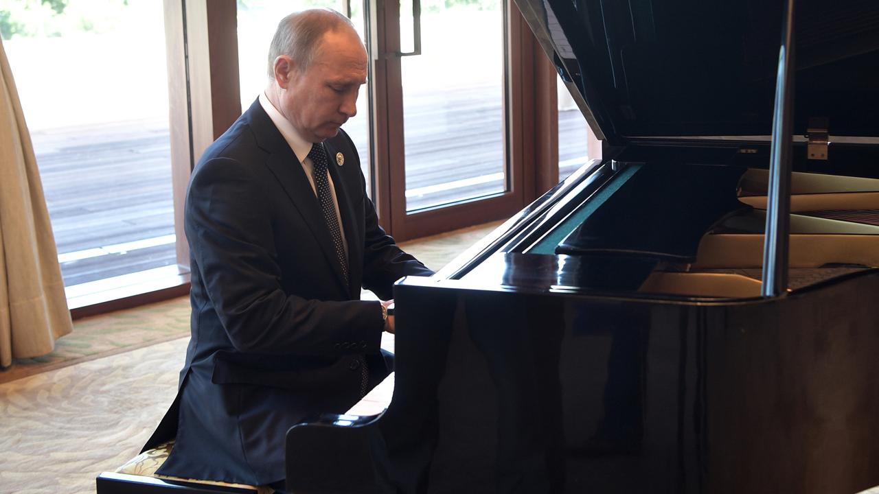 But does he know 'Chopsticks'? Putin shows off piano skills