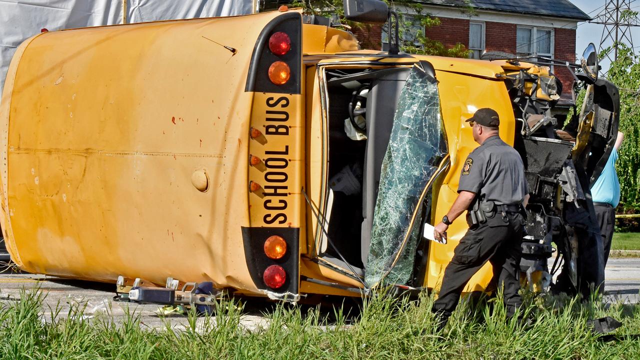 Students, driver hospitalized after packed school bus flips