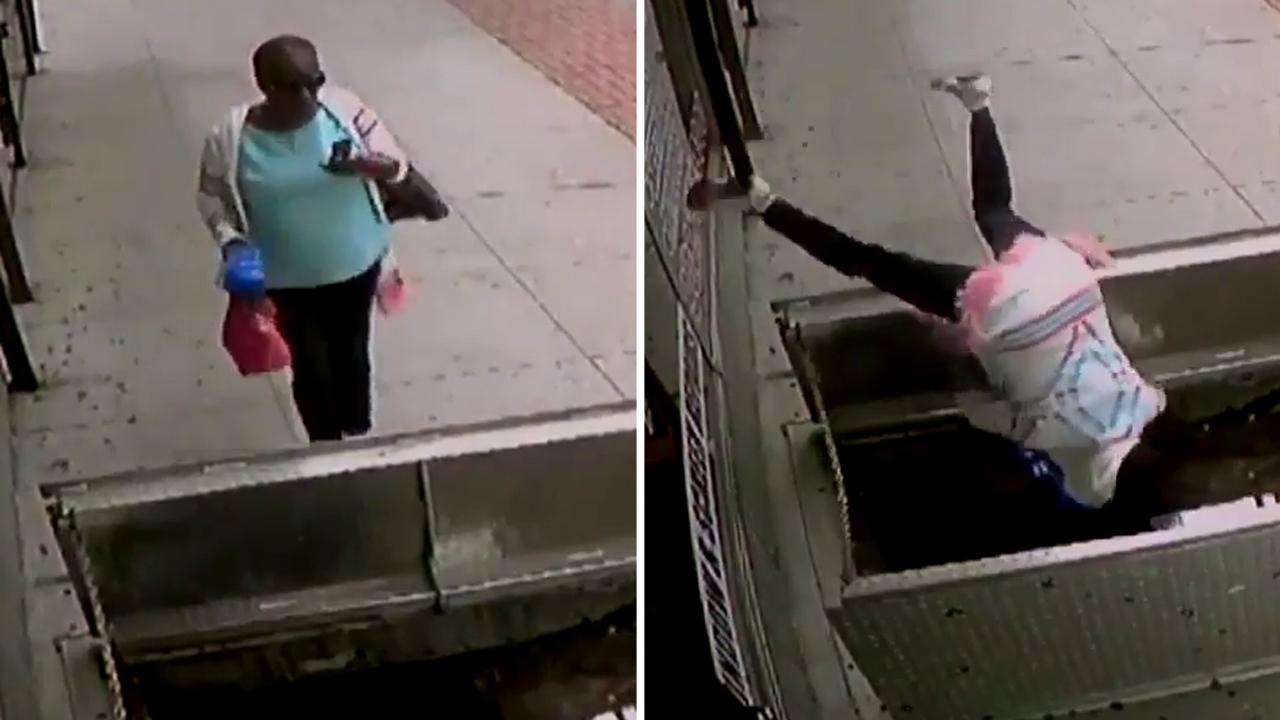 Look out below! Distracted woman tumbles into sidewalk hatch