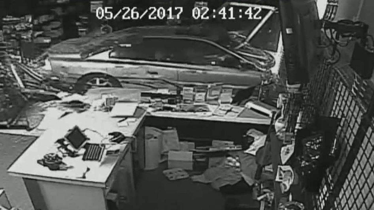 Smash and grab thieves crash vehicles into gun stores