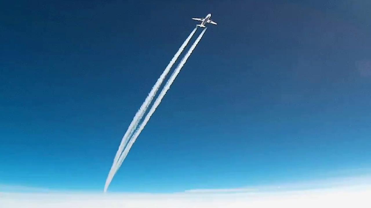 Close call: Commercial jetliner screams past weather balloon