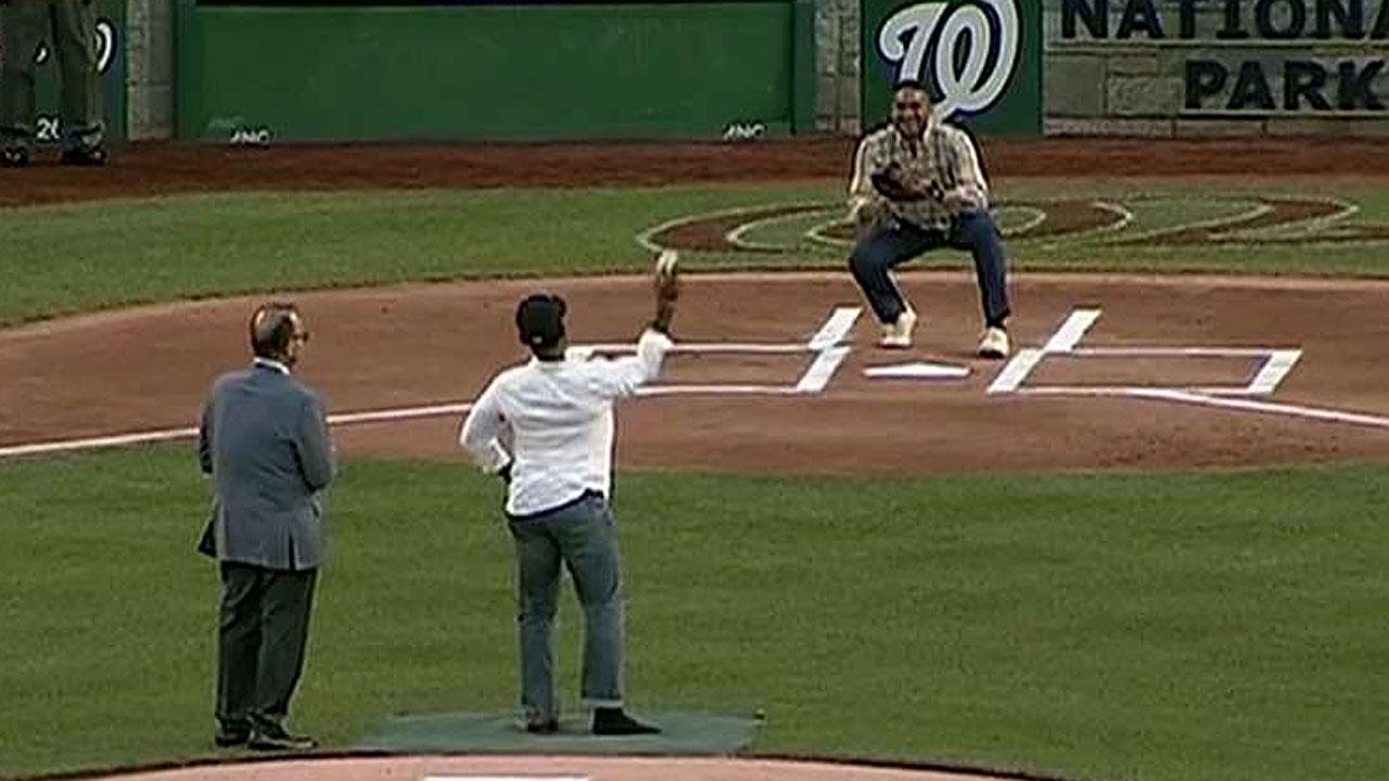 Injured officer throws first pitch at Congress' ball game