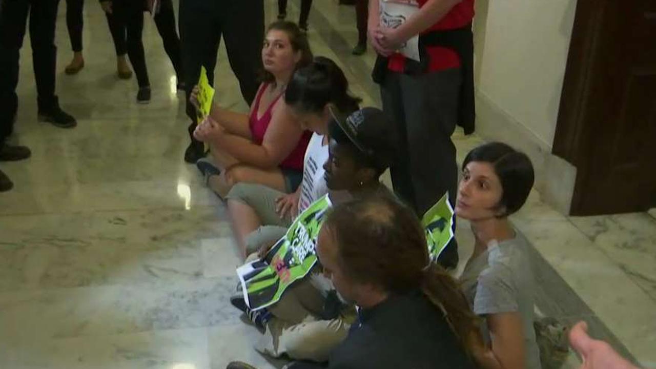 Health care protesters stage Capitol Hill sit-in