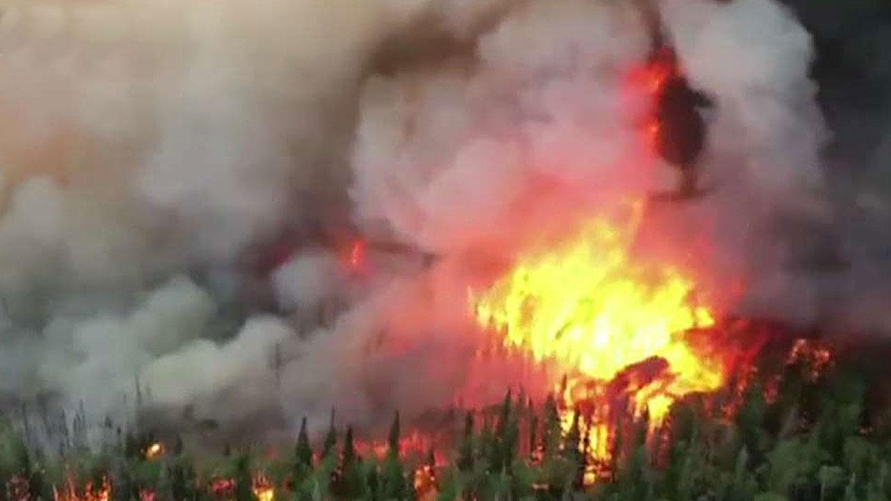 Crews battle wildfires across Western states