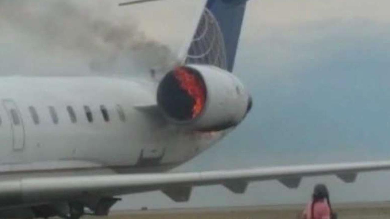 Plane engine bursts into flames on the tarmac