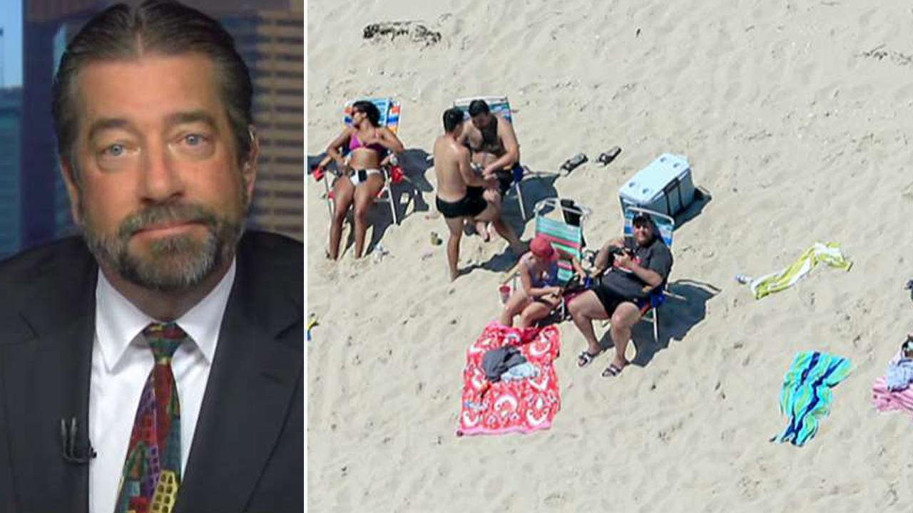 Christie's press secretary defends governor's beach outing
