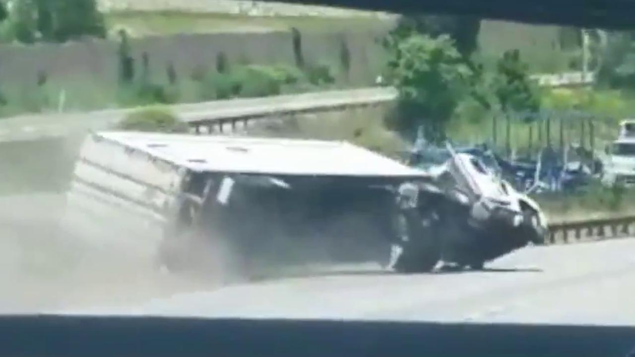 Truck flips on highway, good Samaritans rush to save driver