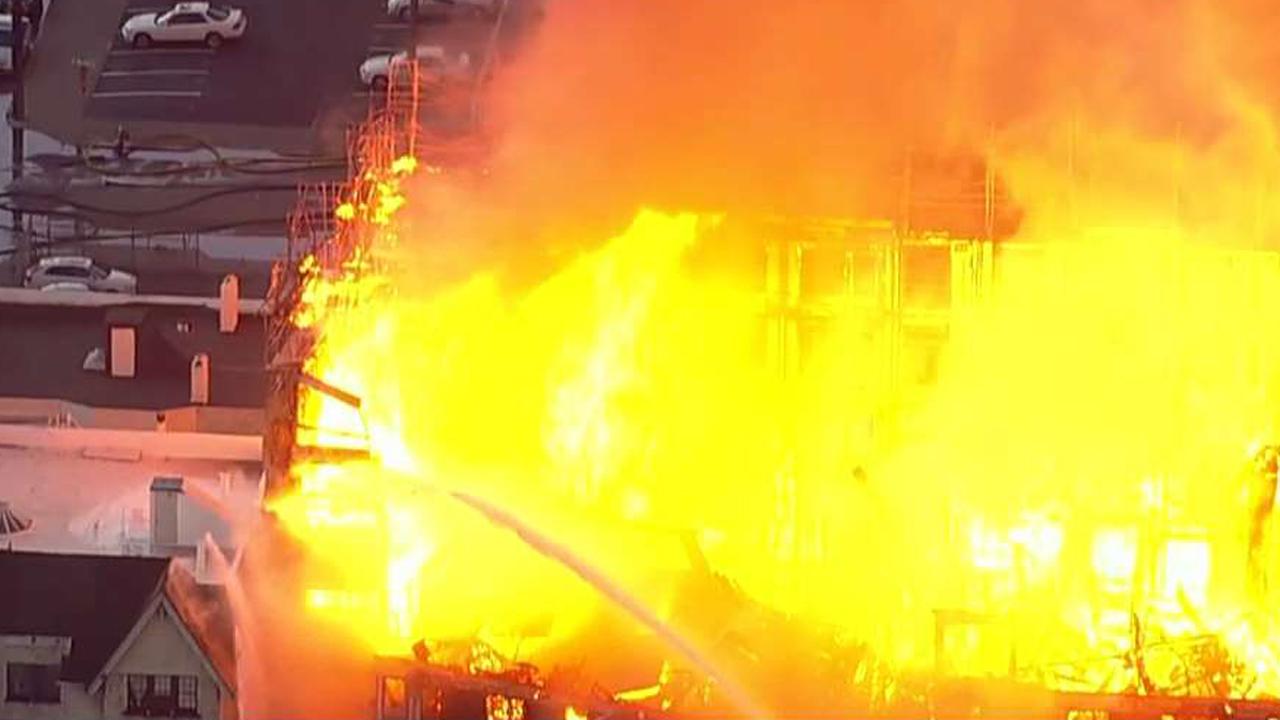 Firefighters battle structure fire in Oakland, California