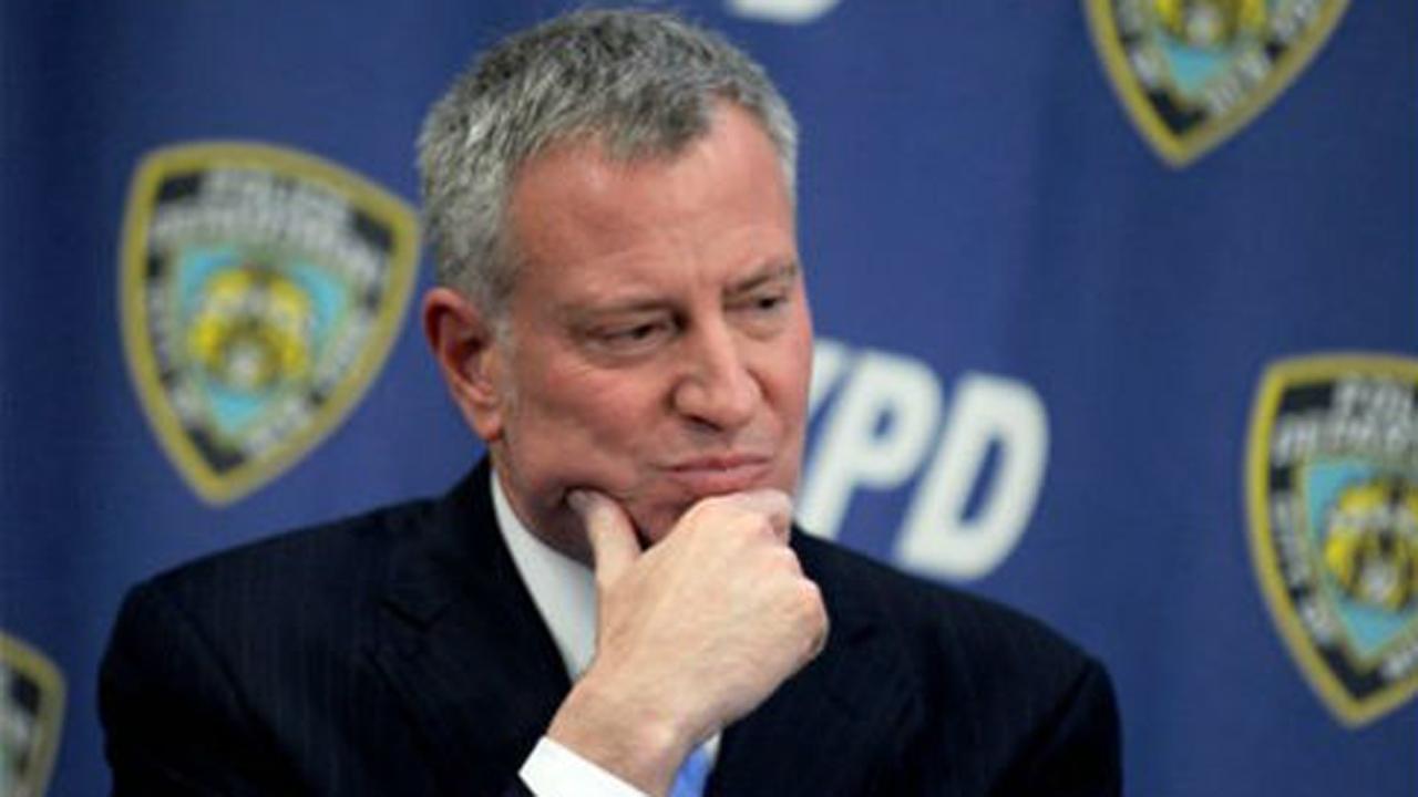 NYC mayor skips NYPD swearing-in ceremony to join protest