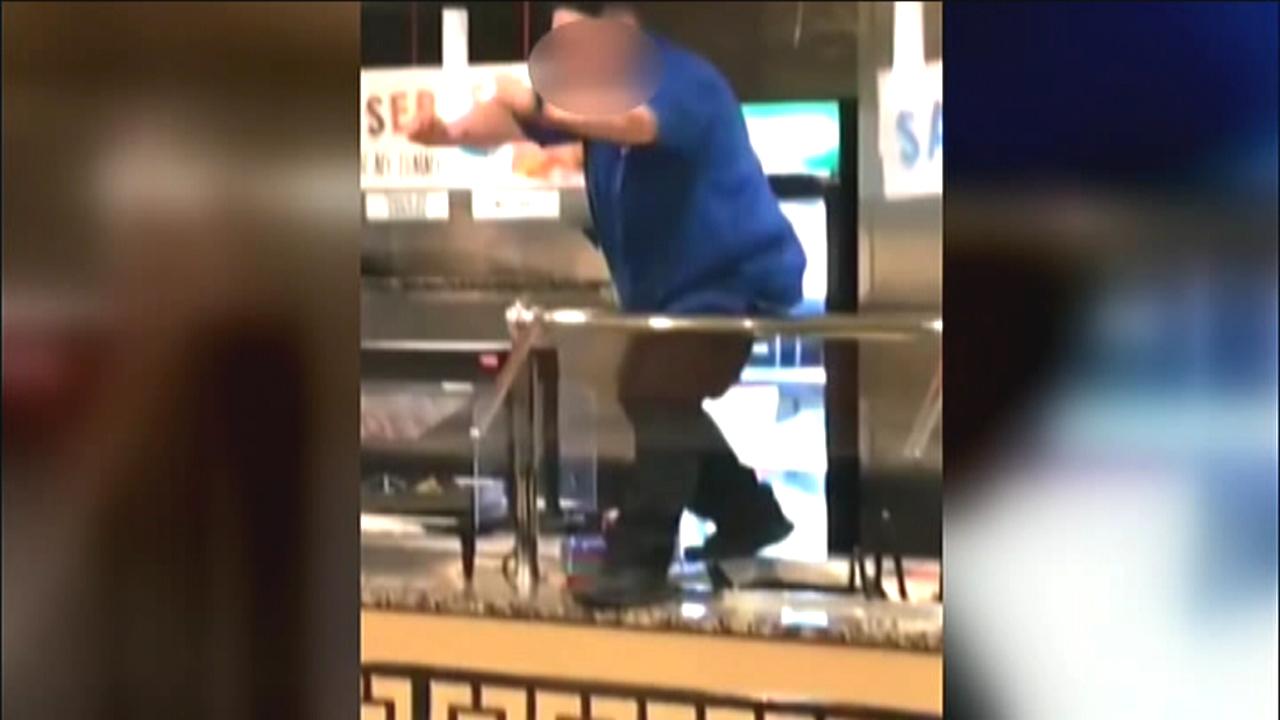Restaurant workers gone wild: Manager dances on buffet bar