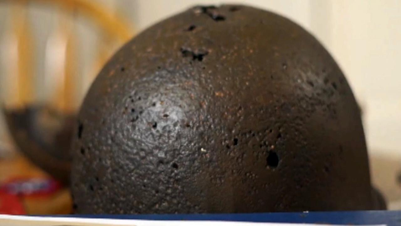 Woman reunited with father's WWII helmet