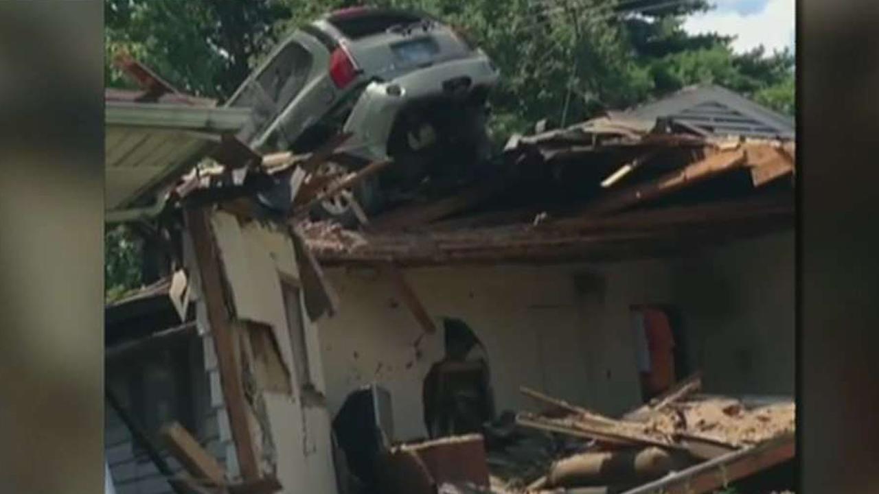 Car crashes onto the roof of St. Louis home
