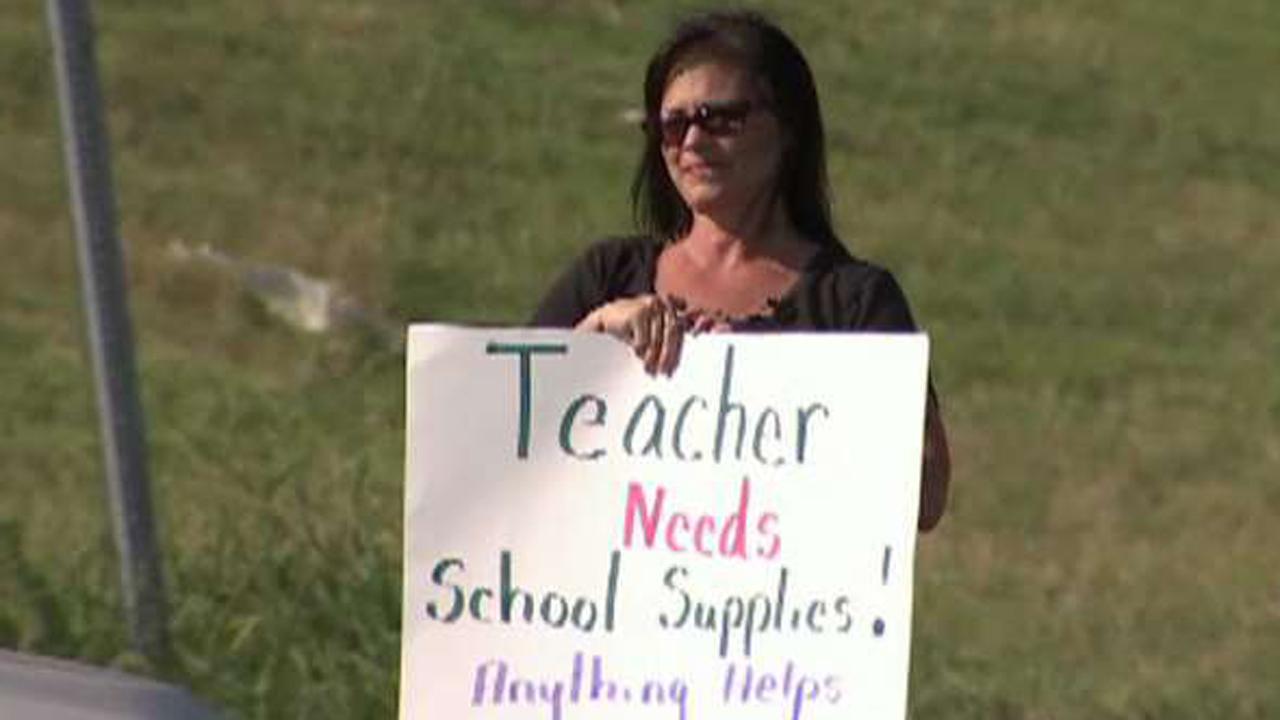 Teacher panhandles for school supplies money