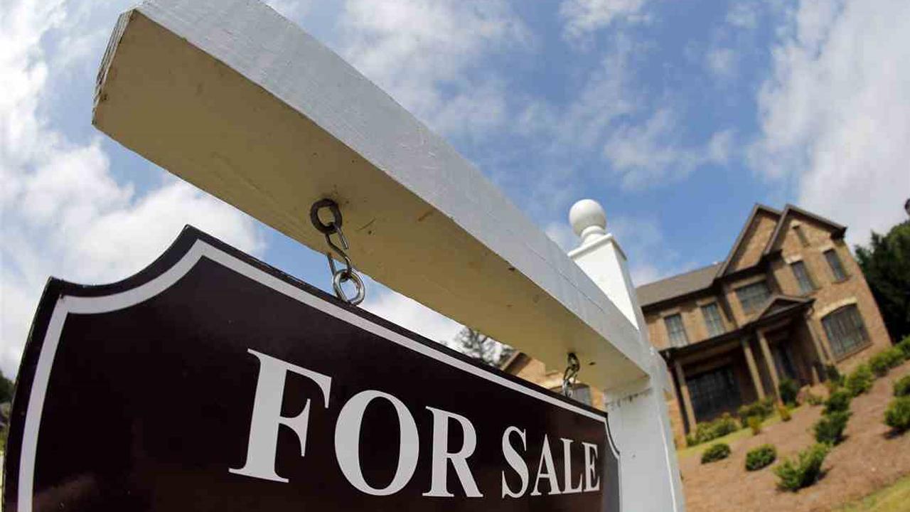 Home sales stumble as prices reach record highs