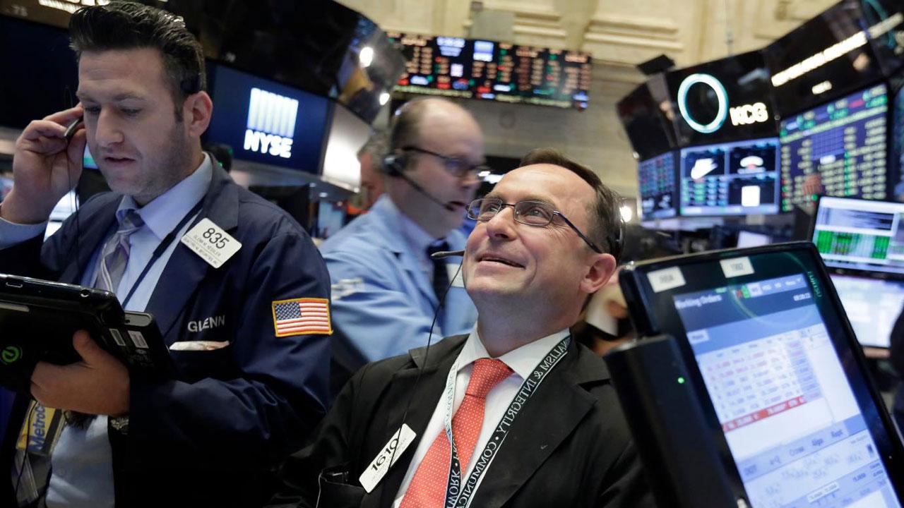 Dow closes above 22,000 for first time ever