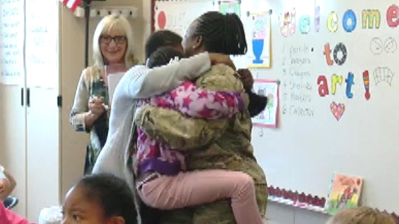 Military mom's early homecoming surprises her kids at school