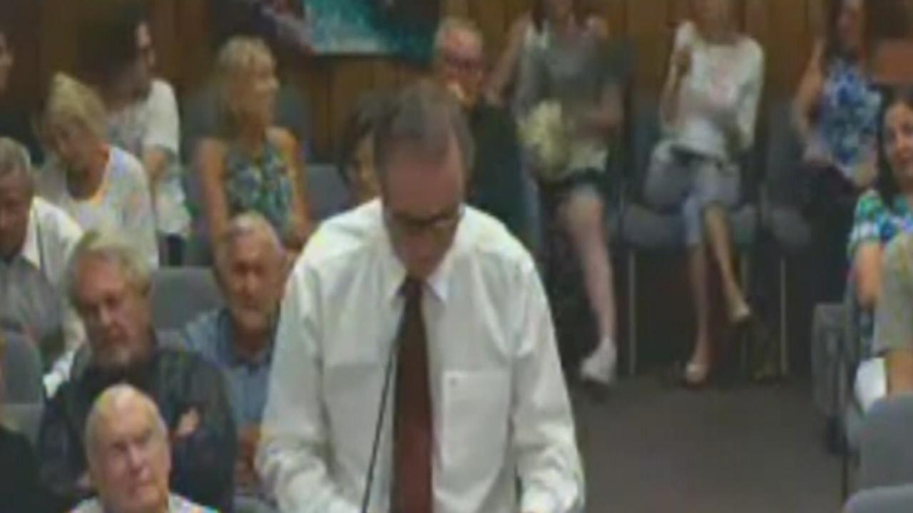 Woman's purse catches fire at city council meeting