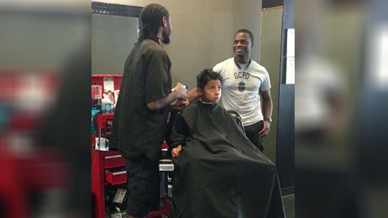 Police officer buys kids back-to-school haircuts