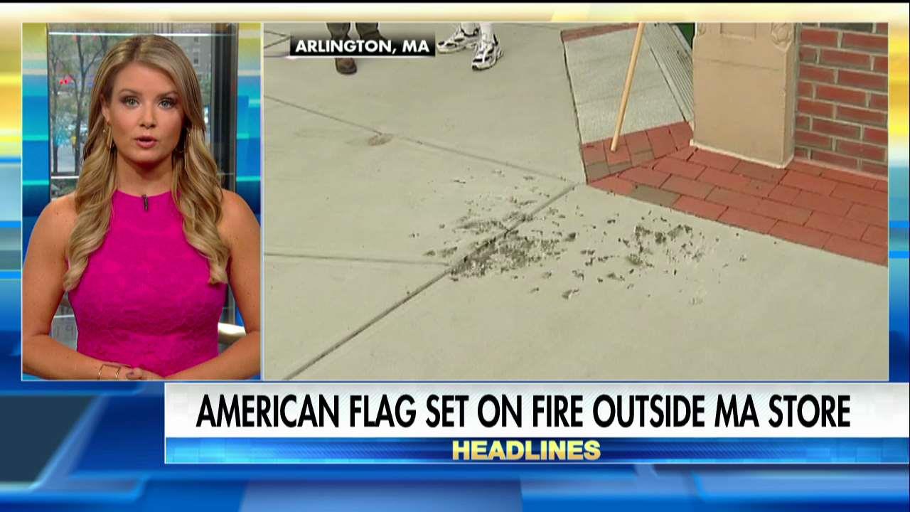 American flag burned outside small business.