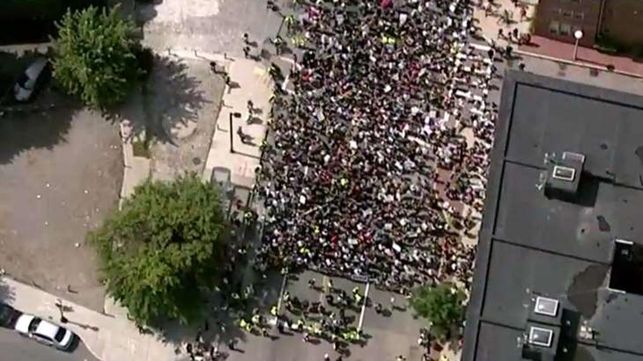 Thousands of protesters march in Boston