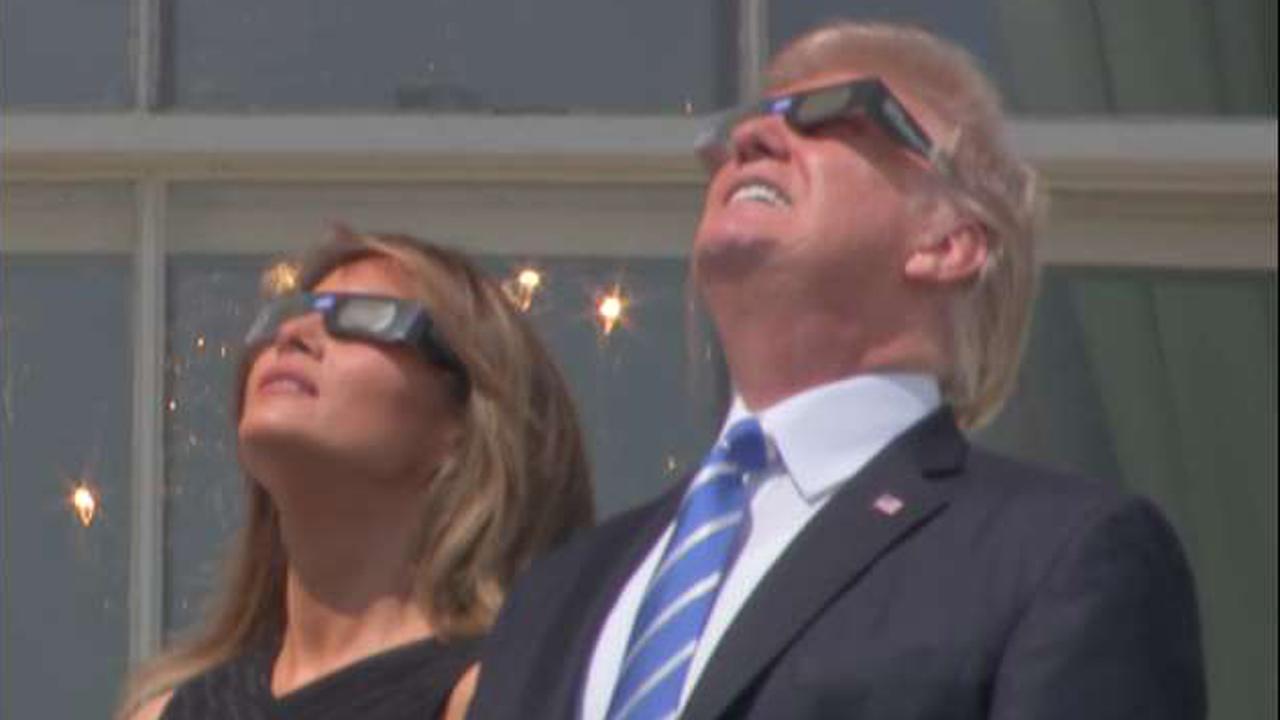 President Trump, first lady watch eclipse from White House