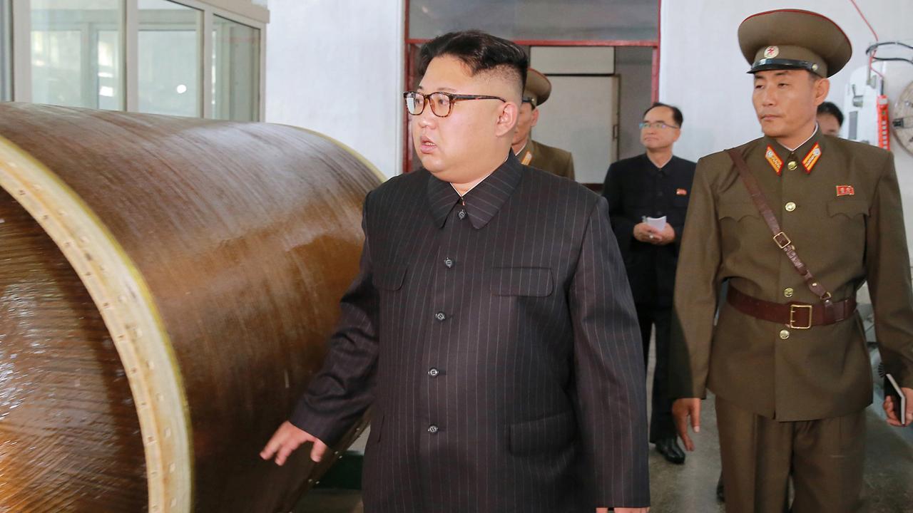 Images show Kim Jong Un with potential new missile plans
