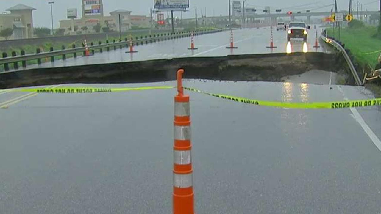 Sinkhole rips open four-lane road in Houston suburb