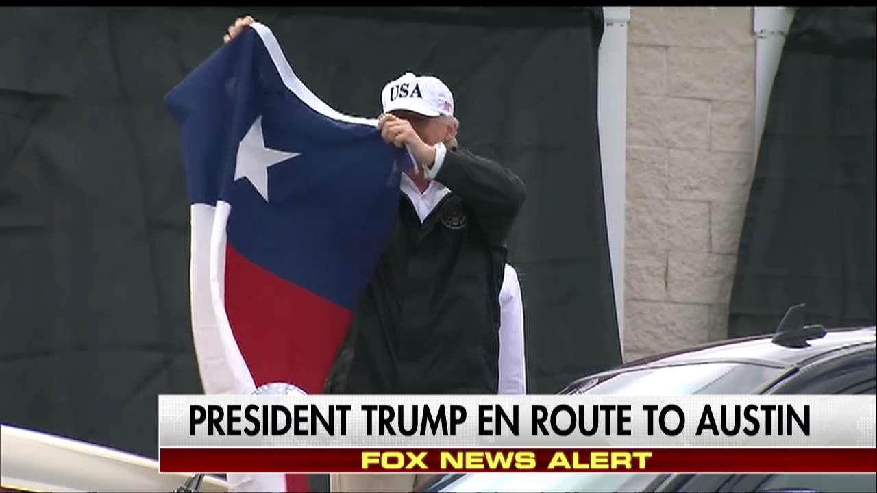 Trump waves Texas flag, addresses crowd. 