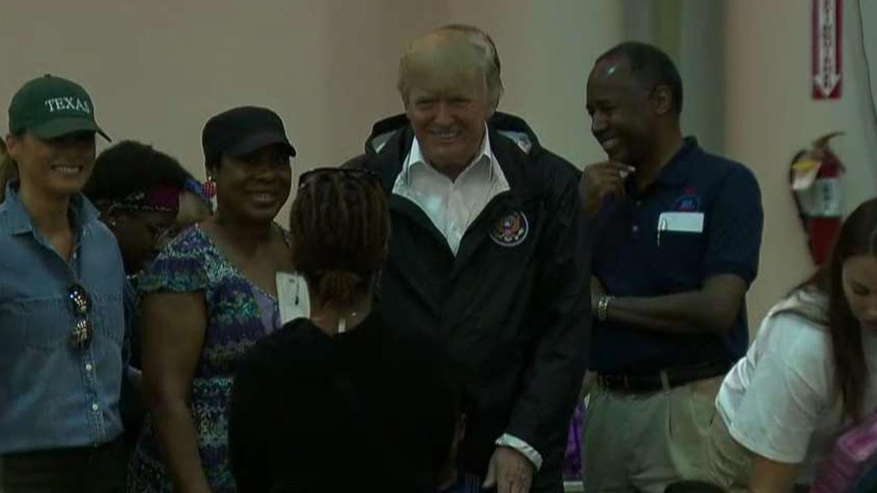 President and first lady meet Harvey victims at NRG Center